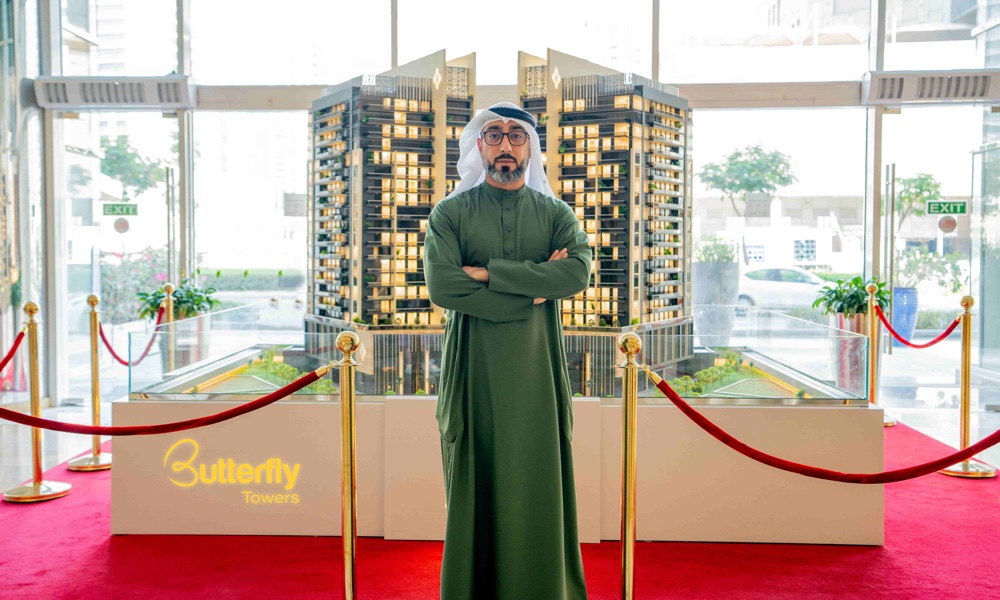 Marwan-Al-Sayyah-CEO-of-Al-Sayyah-Group-showcasing-a-model-of-the-Butterfly-Towers.jpg
