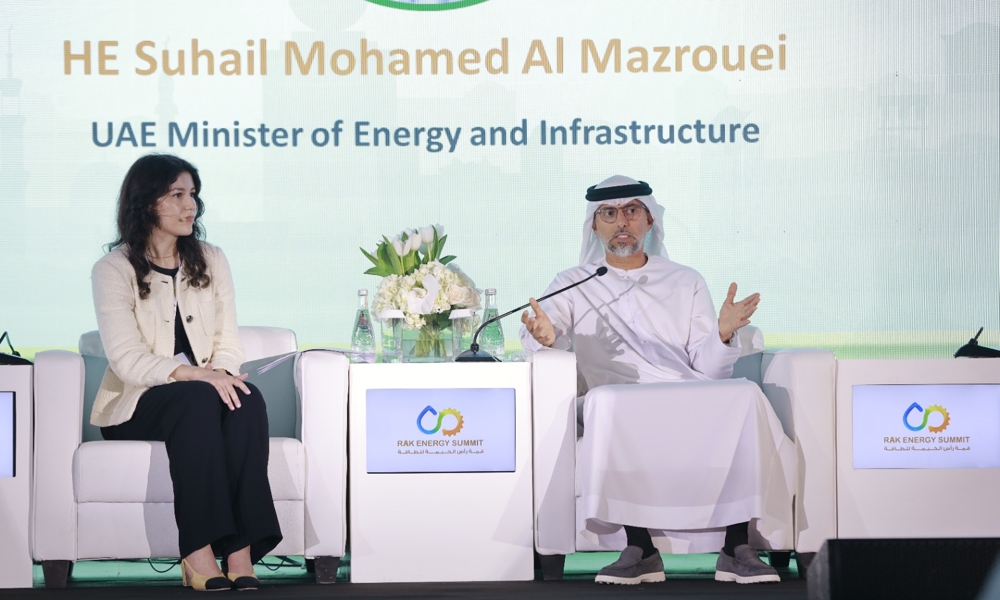 Session-Chair-Razan-Al-Ghussein-welcomes-HE-Suhail-Mohamed-Al-Mazrouei-UAE-Minister-of-Energy-and-Infrastructure1.jpg